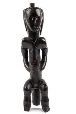 Lot 447 - A wood-carved African sculpture