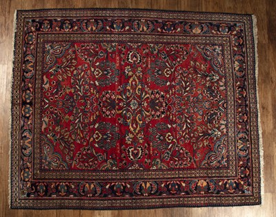 Lot 119 - Wool rust ground rug with central radiating...