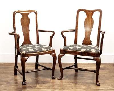 Lot 77 - Near pair of mahogany and walnut elbow chairs...