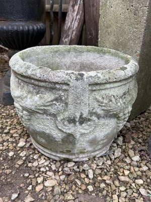 Lot 1349 - A group of three cast reconstituted stone garden planters