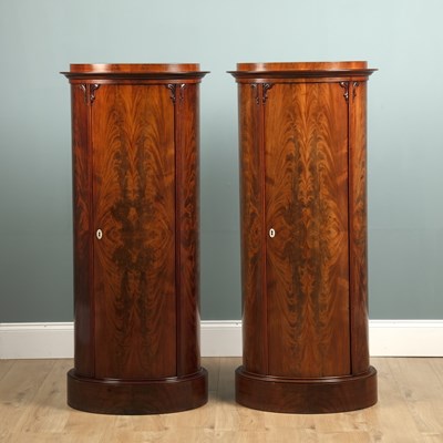 Lot 274 - A pair of mid-19th century oval pedestal cabinets