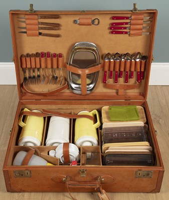 Lot 1158 - A cased leather picnic hamper for four people