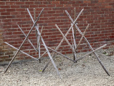 Lot 1428 - A pair of rustic tripod plant supports