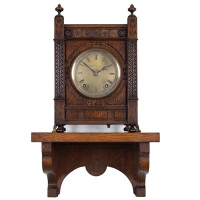 Lot 659 - A 19th century oak mantel clock and bracket