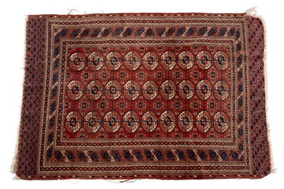 Lot 1300 - An early 20th century woollen hand-woven Turkoman rug