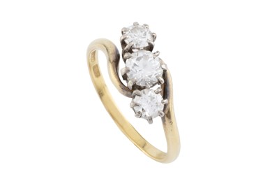 Lot 128 - A diamond three stone ring, of crossover...