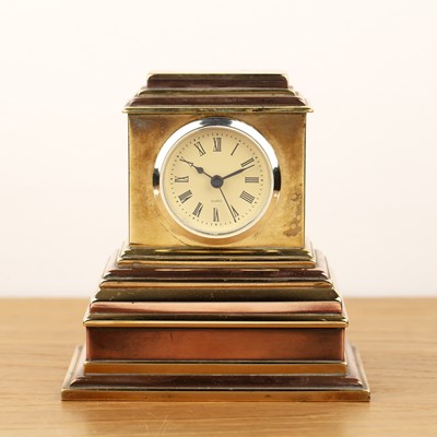 Lot 198 - Brass and copper cased mantel clock on a...