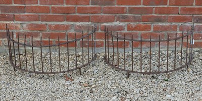 Lot 1420 - A pair of circular wrought iron low tree guards