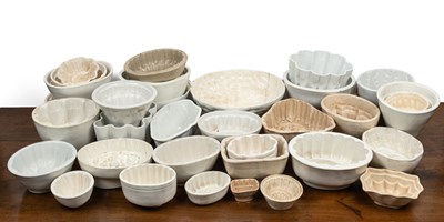 Lot 425 - A collection of thirty-four 19th and early 20th century ceramic jelly moulds