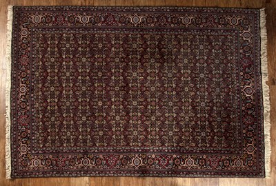 Lot 116 - Kashmiri part silk and wool rug with a...