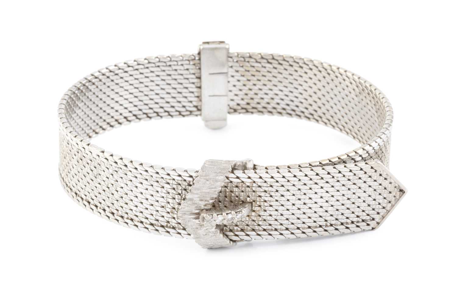 Lot 258 - A diamond set jarretière bracelet, of textured...