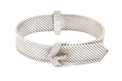 Lot 258 - A diamond set jarretière bracelet, of textured...