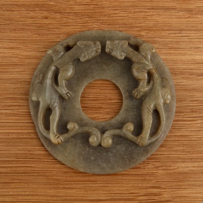 Lot 216 - Pale green ‘Chilong’ disc, Bi Chinese, Ming...