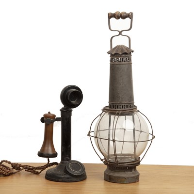 Lot 111 - Candlestick phone and a storm lantern the...