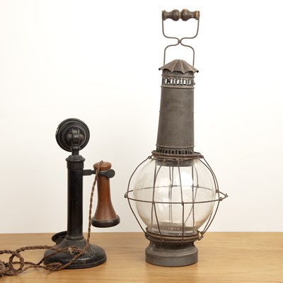 Lot 111 - Candlestick phone and a storm lantern the...