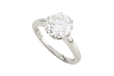 Lot A diamond single stone ring, the round...