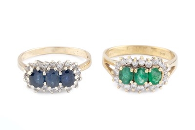 Lot 207 - An emerald and diamond triple cluster ring,...