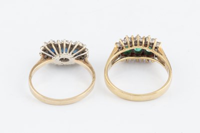 Lot 207 - An emerald and diamond triple cluster ring,...