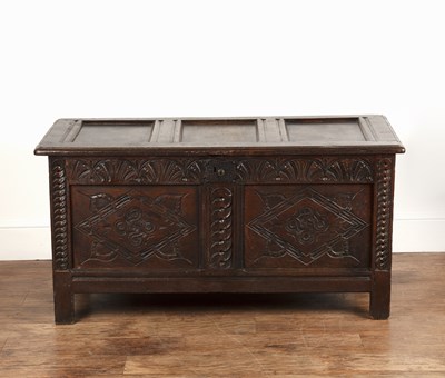 Lot 100 - Oak coffer 18th Century, with two carved panel...