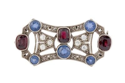 Lot 107 - A diamond and gem set panel brooch, the shaped...