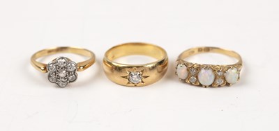 Lot 259A - Three gold rings comprising a yellow metal...