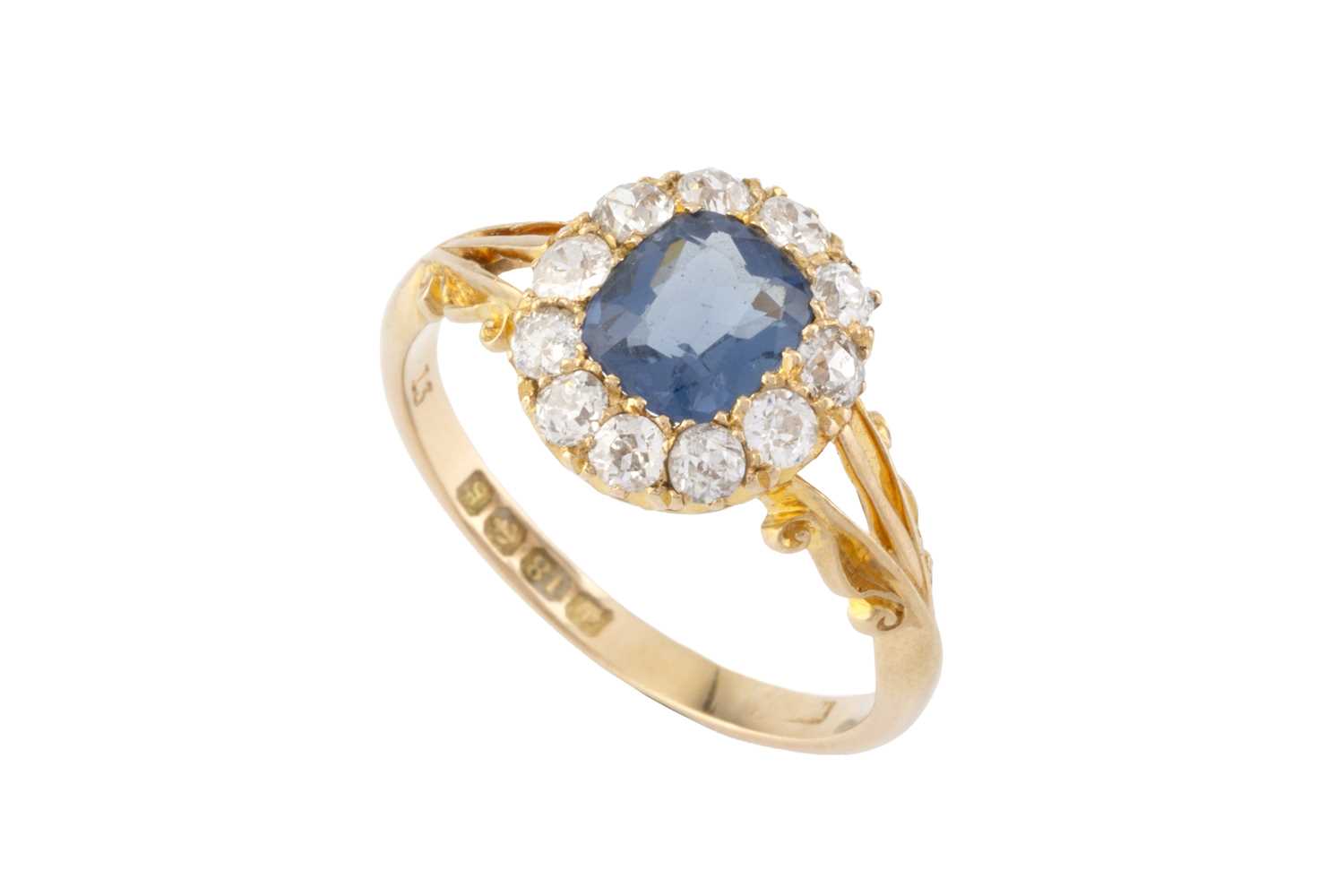 Lot 274 - An Edwardian blue stone and diamond cluster...