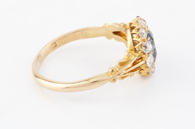 Lot 274 - An Edwardian blue stone and diamond cluster...