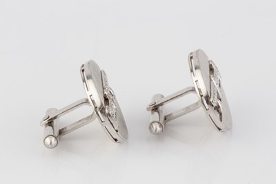 Lot 200 - A pair of diamond set cufflinks, the oval...