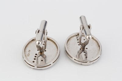 Lot 200 - A pair of diamond set cufflinks, the oval...