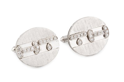 Lot 200 - A pair of diamond set cufflinks, the oval...