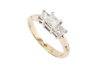 Lot 133 - A diamond three stone ring, the princess-cut...