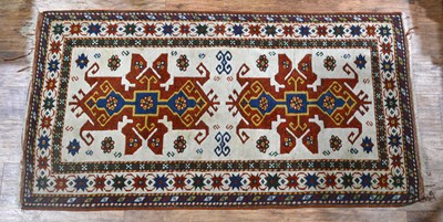 Lot 117A - Ivory ground Kazak rug with two medallions and...