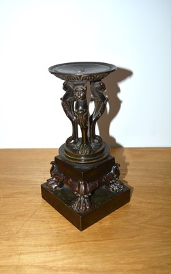 Lot 365 - Bronze classical monopodia candle holder...