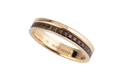 Lot 251 - An 18ct gold 'Quatre Classique' band ring by...