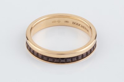Lot 251 - An 18ct gold 'Quatre Classique' band ring by...