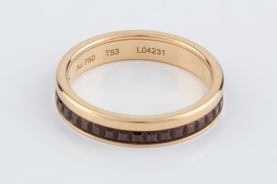 Lot 251 - An 18ct gold 'Quatre Classique' band ring by...