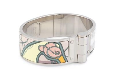 Lot 255 - An enamel 'Coup de Fouet' bangle by Hermès, of...