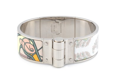 Lot 255 - An enamel 'Coup de Fouet' bangle by Hermès, of...