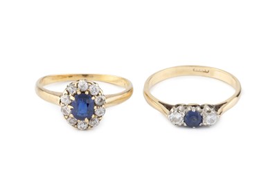 Lot 210 - A sapphire and diamond cluster ring, the oval...