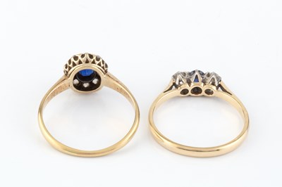 Lot 210 - A sapphire and diamond cluster ring, the oval...