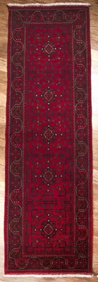 Lot 57 - Hand-knotted wool runner Pakistan, bright red...