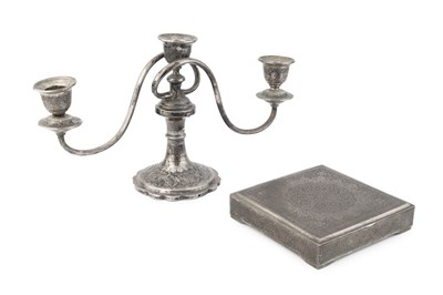 Lot 750 - A Persian white metal three light candelabrum,...