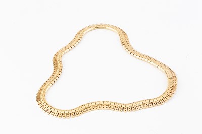 Lot 195 - A yellow precious metal collar necklace, of...