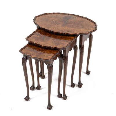 Lot 325 - A 20th century walnut nest of three tables