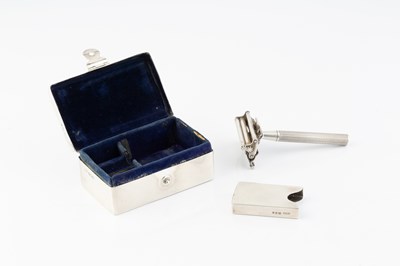 Lot 592 - A silver rectangular shaving box and razor,...