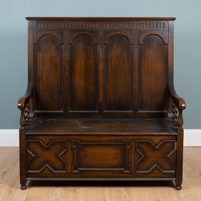 Lot 540 - An early 20th century oak box settle