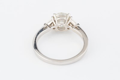 Lot 271 - A diamond three stone ring, the principal...