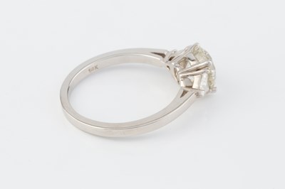 Lot 271 - A diamond three stone ring, the principal...