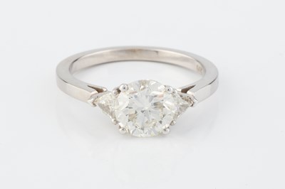 Lot 271 - A diamond three stone ring, the principal...
