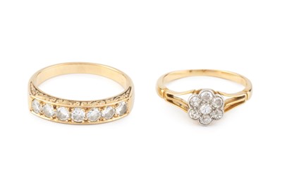 Lot 138 - Two diamond dress rings, the first a half hoop...